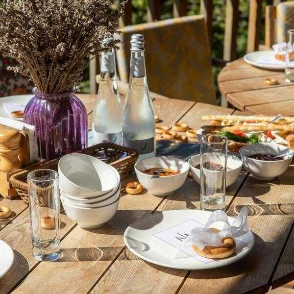 Outdoor table with simple brunch setting in soft natural garden light